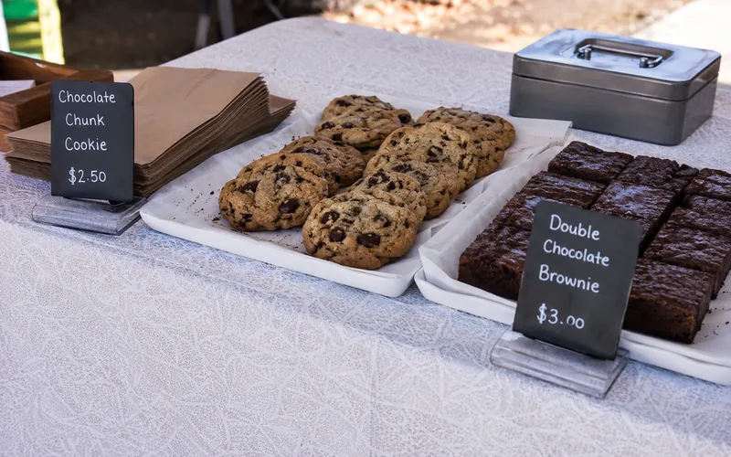 Bake sale table with cookies and brownies